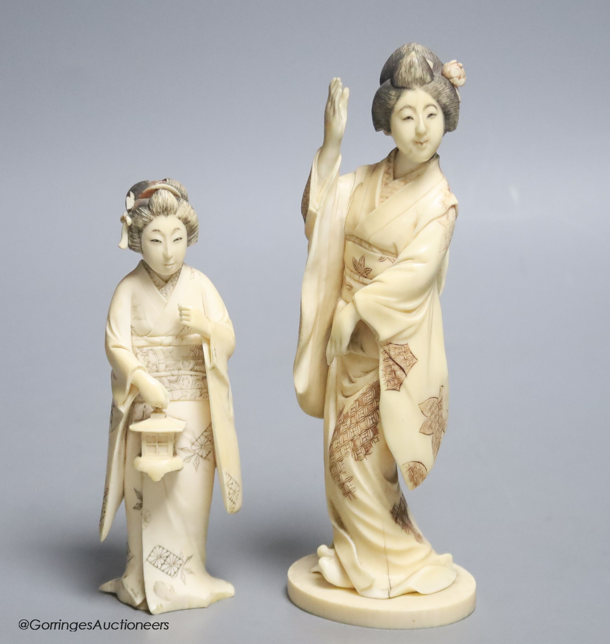 Two Japanese ivory figures of bijin, early 20th century, one signed to the base, height 17.5cm